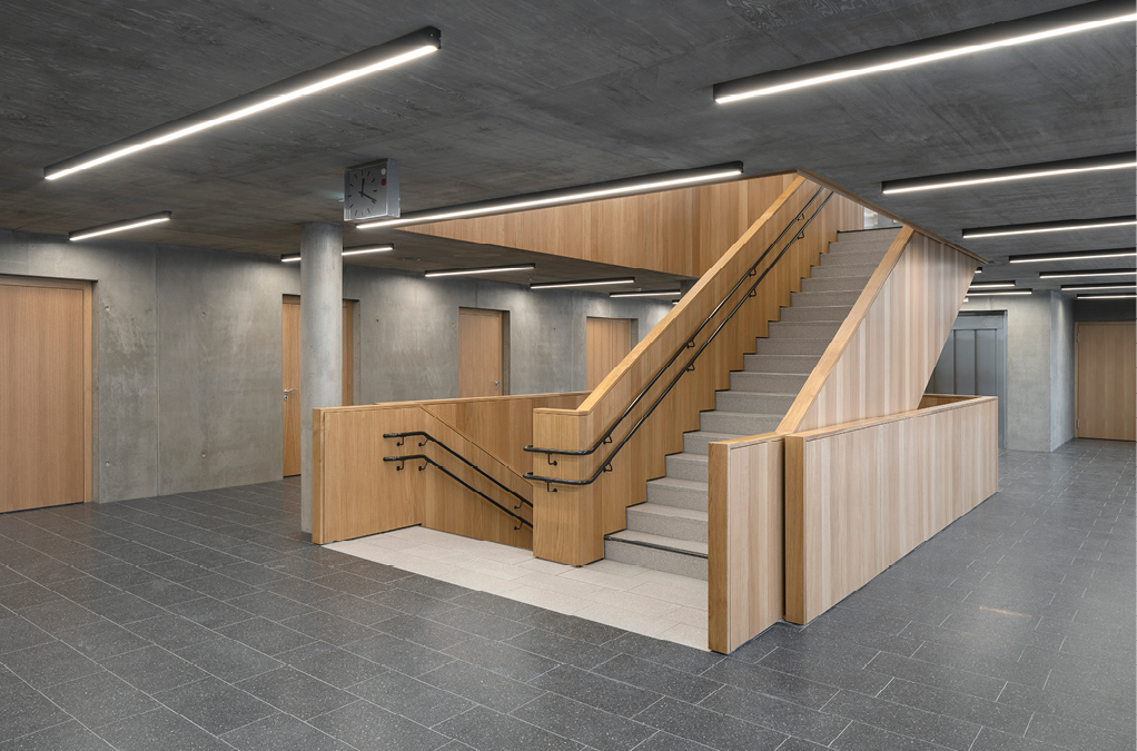 Bild 4 Sichtbares Holz und Beton prägen das Materialkonzept der Innenräume (Quelle: PRIMUS developments)